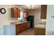 Traditional kitchen with light wood cabinets, gray countertops, stainless steel appliances, and modern faucet at 12328 Shafton Rd, Spring Hill, FL 34608
