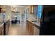 Modern kitchen featuring stainless steel appliances, granite countertops and adjacent dining area at 12328 Shafton Rd, Spring Hill, FL 34608