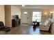 Cozy living room with light colored walls, luxury vinyl flooring, and lots of natural light at 12328 Shafton Rd, Spring Hill, FL 34608