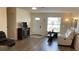 Cozy living room with light colored walls, luxury vinyl flooring, and lots of natural light at 12328 Shafton Rd, Spring Hill, FL 34608