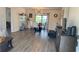 Open living and dining area featuring luxury vinyl flooring, and lots of natural light at 12328 Shafton Rd, Spring Hill, FL 34608