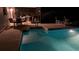 A pristine in-ground pool with a seating area, perfect for relaxation and enjoyment at 12328 Shafton Rd, Spring Hill, FL 34608