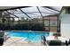 Pool area with lounge chairs, a patio table, and a tranquil vibe at 12328 Shafton Rd, Spring Hill, FL 34608