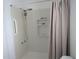 Enclosed shower with shower head, safety bar, and built in toiletry storage at 12328 Shafton Rd, Spring Hill, FL 34608