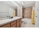 Bathroom featuring vanity, shower-tub, and tiled floor at 12443 Country White Cir, Tampa, FL 33635