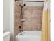 Shower with decorative tiles and hardware, and a detachable shower head at 12443 Country White Cir, Tampa, FL 33635