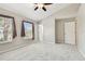 Bright bedroom featuring neutral paint, carpet, and a window with view of the property at 12443 Country White Cir, Tampa, FL 33635