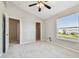 Well-lit bedroom featuring a closet, window, and ensuite bathroom at 12443 Country White Cir, Tampa, FL 33635