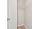 Walk-in closet with built-in shelving for organizing clothing and accessories at 12443 Country White Cir, Tampa, FL 33635