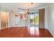 Open dining area features hardwood floors and a sliding glass door leading to the outside at 12443 Country White Cir, Tampa, FL 33635