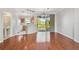 Open dining area featuring hardwood floors and a sliding glass door with views of the water at 12443 Country White Cir, Tampa, FL 33635