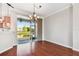 Open dining space showcasing hardwood floors and a sliding glass door with a water view at 12443 Country White Cir, Tampa, FL 33635