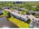 A beautiful view of the townhome with a scenic pond, lush greenery, and mature trees enhancing the landscape at 12443 Country White Cir, Tampa, FL 33635