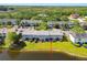 Exterior shot of the rear of the townhome featuring a screened patio, and a pond view at 12443 Country White Cir, Tampa, FL 33635