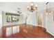 Spacious living room with hardwood floors, a ceiling fan, and a view of the entryway at 12443 Country White Cir, Tampa, FL 33635