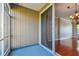 Screened lanai with a view into the living room allows seamless transition between indoor and outdoor living spaces at 12443 Country White Cir, Tampa, FL 33635