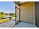 Enjoy a scenic view of the lake from this screened lanai, complete with tiled patio and serene surroundings at 12443 Country White Cir, Tampa, FL 33635