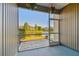 Enjoy the pond view from the screened lanai, perfect for relaxing while overlooking the beautiful landscape at 12443 Country White Cir, Tampa, FL 33635