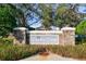 Community signage with stone pillars for Country Chase Townhomes at 12443 Country White Cir, Tampa, FL 33635