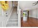 View of the carpeted staircase leading to the upper level, adjacent to the living space at 12443 Country White Cir, Tampa, FL 33635