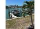 A private boat dock on the canal offers convenient water access and outdoor enjoyment at 12478 Capri Circle N # 2, Treasure Island, FL 33706