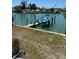 Enjoy waterfront living with a private boat lift, providing easy access to the waterways at 12478 Capri Circle N # 2, Treasure Island, FL 33706