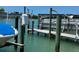 View of boat dock with boat, providing convenient access to the water at 12478 Capri Circle N # 2, Treasure Island, FL 33706