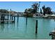 Scenic view of waterfront property featuring a boat dock at 12478 Capri Circle N # 2, Treasure Island, FL 33706