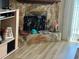 Close-up view of a stone fireplace with decor and a light wood-colored floor at 12478 Capri Circle N # 2, Treasure Island, FL 33706