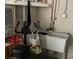 Garage with storage sink, exercise bike, workbench, and accessories at 12478 Capri Circle N # 2, Treasure Island, FL 33706