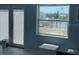 View from a window to a waterway; door and window covered by hurricane shutters at 12478 Capri Circle N # 2, Treasure Island, FL 33706