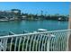 Scenic view of water and boat docks as seen from balcony with white railing at 12478 Capri Circle N # 2, Treasure Island, FL 33706