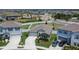 Aerial view of home showcasing its manicured lawn, driveway, and location within a well-maintained neighborhood at 13506 Wild Ginger St, Riverview, FL 33579