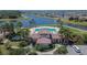 Aerial view of clubhouse, pool, landscaping and neighborhood at 13506 Wild Ginger St, Riverview, FL 33579