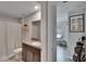 Bathroom featuring a granite-look vanity top and shower curtain plus golf equipment nearby at 13506 Wild Ginger St, Riverview, FL 33579