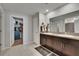 Bathroom with double vanity sinks and mirrors, complemented by neutral walls and floors at 13506 Wild Ginger St, Riverview, FL 33579