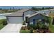 Charming single-story home featuring a two-car garage, manicured landscaping, and neutral-toned exterior at 13506 Wild Ginger St, Riverview, FL 33579