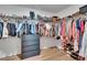 Spacious walk-in closet with built-in shelving, drawers, and ample storage for clothing and accessories at 13506 Wild Ginger St, Riverview, FL 33579
