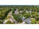 Desirable neighborhood featuring mature trees, lush landscaping, and convenient access to area amenities at 13891 Feather Sound Dr, Clearwater, FL 33762