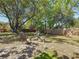 Backyard area showcasing a fire pit surrounded by comfortable seating in a spacious outdoor space at 13891 Feather Sound Dr, Clearwater, FL 33762