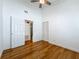 Bright bedroom featuring bamboo floors, a ceiling fan, and a closet at 13891 Feather Sound Dr, Clearwater, FL 33762