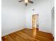 Bright bedroom featuring bamboo floors, a ceiling fan, and open access to another room at 13891 Feather Sound Dr, Clearwater, FL 33762