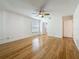 Bedroom featuring hardwood floors, a closet, and a window providing natural light at 13891 Feather Sound Dr, Clearwater, FL 33762