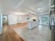 Bright kitchen with stainless steel appliances and granite counters, seamlessly connecting to the living area at 13891 Feather Sound Dr, Clearwater, FL 33762