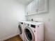 Convenient laundry room featuring a modern washer and dryer at 13891 Feather Sound Dr, Clearwater, FL 33762