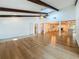 Expansive living space showcases hardwood floors, wooden beam ceilings and an open floor plan at 13891 Feather Sound Dr, Clearwater, FL 33762