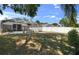 Spacious backyard with an enclosed pool and patio area, privacy fence, and lots of shade at 1406 Bloomingdale Trails Blvd, Brandon, FL 33511