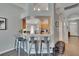Breakfast bar with pendant lighting offers a seamless transition to the kitchen at 1406 Bloomingdale Trails Blvd, Brandon, FL 33511