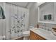 Bathroom featuring a vanity with a sink and a shower/tub with blue floral shower curtain at 1406 Bloomingdale Trails Blvd, Brandon, FL 33511
