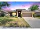 Charming single-story home with a well-manicured lawn, inviting front porch, and two-car garage at 1406 Bloomingdale Trails Blvd, Brandon, FL 33511